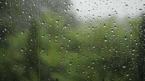 Rain Drops Sliding on Window Glass. Heavy Rain With Gusts of Wind Pours Thr.. Video stock 330130363