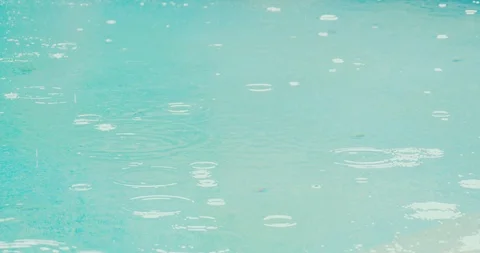 Rain drops in slow motion on blue water Stock Footage 101121951