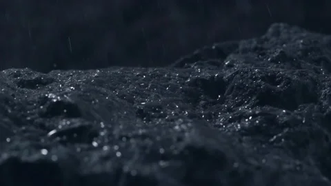 Rain drops in slow motion illuminated by the moon light, 1000 fps, close up rain Stock Footage 253563874