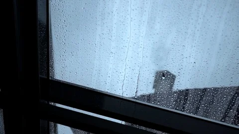 Rain drops slowly flow down the transparent roof window, close-up Stock-Footage 85022120