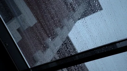 Rain drops slowly flow down the transparent roof window, close-up Stock-Footage 85024104