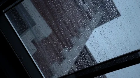 Rain drops slowly flow down the transparent roof window, close-up Stock-Footage 85029030