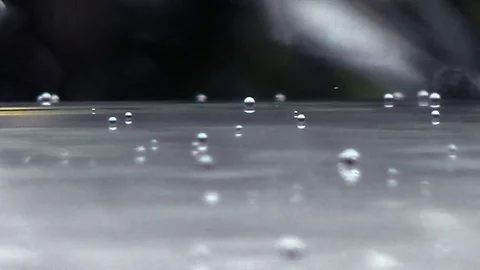 Rain drops on smooth surface Stock Footage 78702617