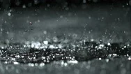 Rain Drops Splashing In Puddle Stock Footage