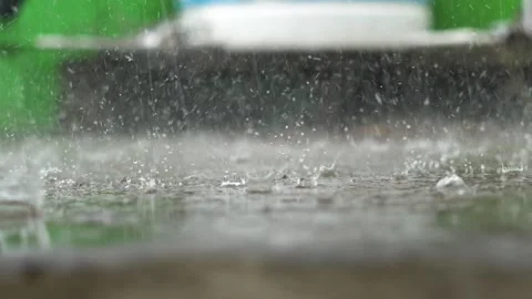 Rain Drops Splashing on Water Surface Monsoon Background Closeup. Stock Footage 332461177