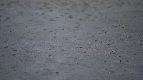 Rain drops. summer heavy rain drops falling into puddles on asphalt Stock Footage 269670131