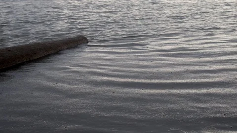 Rain drops on surface of river Stock Footage 111593838