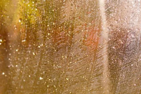 Rain Drops On Surface of wet Window Glass pane In Rainy Season. Abstract back Stock Photos