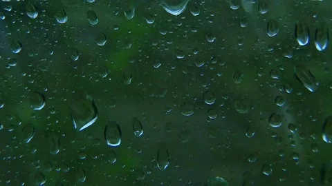Rain drops on train window. Abstract nature slow motion tracking video Stock Footage 73350895