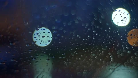 Rain Drops Water Flowing Down Car Windshield on Full Moon Night Stock Footage 239161349