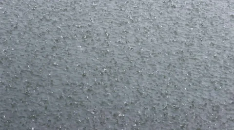 Rain drops in the water Stock Footage 32215552