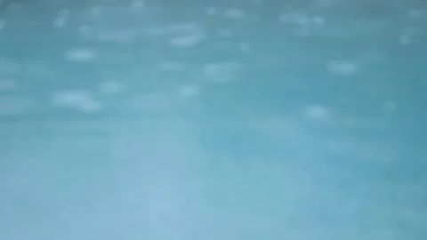 Rain drops in the water. Object out of focus. Stock Footage 113932569