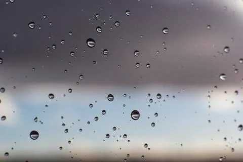 Rain drops on a window after a storm Stock Photos