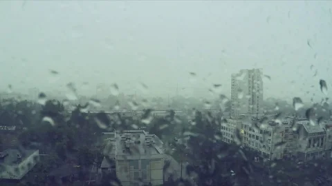Rain drops on window and city outside Stock Footage 82367000