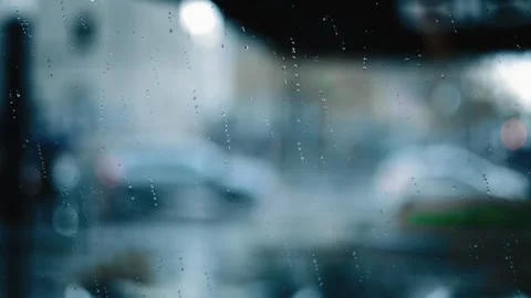 Rain drops on window blurred background Stock Footage 277824986