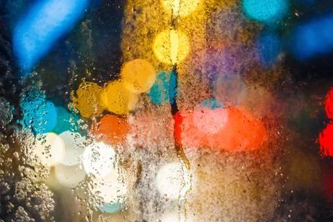 Rain drops on window with blurry background Stock Photos