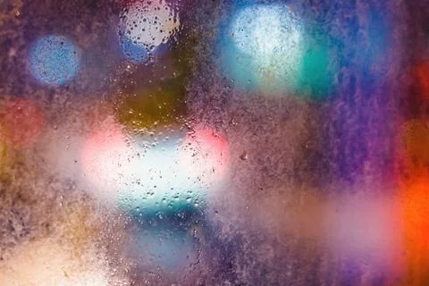Rain drops on window with blurry background Stock Photos