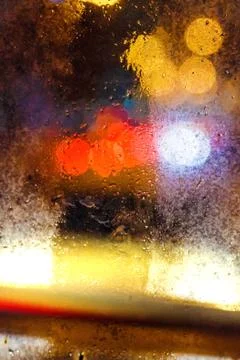 Rain drops on window with bokeh Stock Photos
