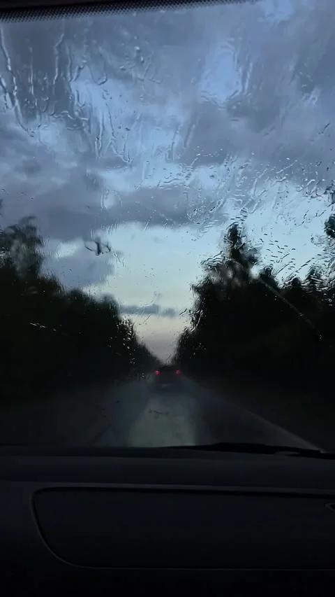 Rain drops on window car windshield. View from the inside of a driving car. Stock Footage 211490996