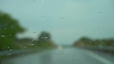 Rain drops on window car windshield. View from the inside of a driving car. 스톡 동영상 294700319