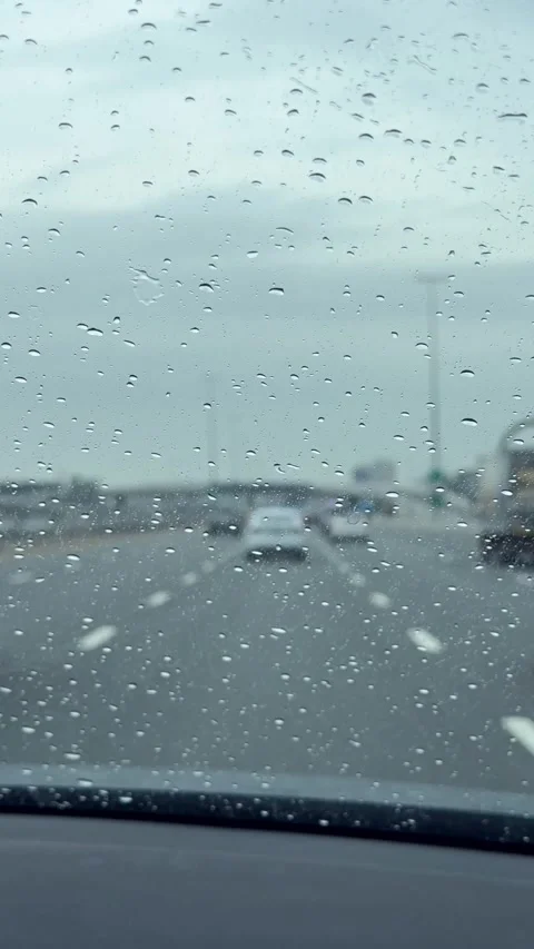 Rain drops on window car windshield. View from the inside of a driving car Stock Footage 311201459