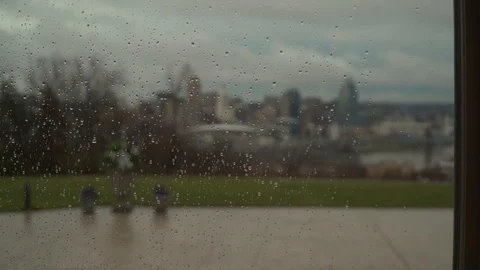 Rain Drops on Window City in Background Slow Motion Stock Footage 99263393