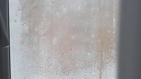 Rain drops on the window with closed tulle Stock-Footage 100025561