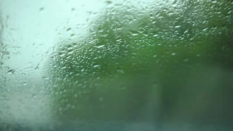 Rain Drops on Window Creating a Soothing and Calm Rainy Day Mood Stock Footage 316401107