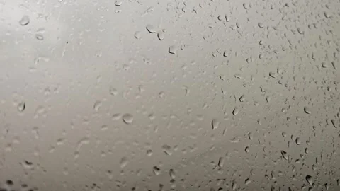 Rain drops on window in different frames showing varied patterns and views Stock Footage 339595474