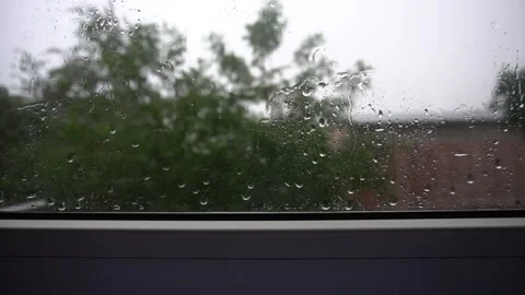 Rain drops on window during a thunderstorm. Stock Footage 91590582