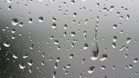 Rain drops on a window Stock Footage 84589816