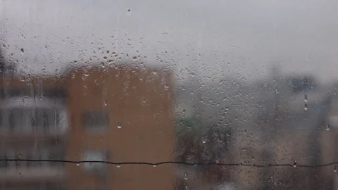 Rain Drops on Window Glass with Brick Apartment Building Outside Stock-Footage 332273778