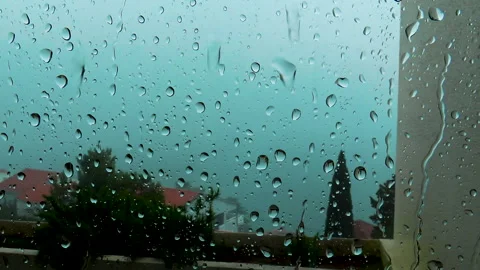 Rain drops at window glass during summer storm. Video stock 155002453