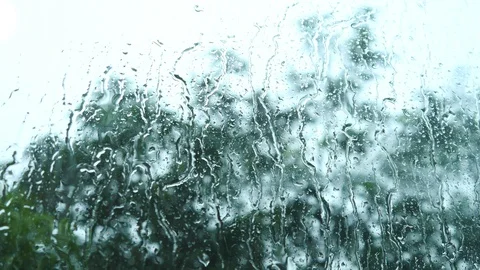 Rain drops on the window glass Isolated from the tree background. 動画素材 129362516