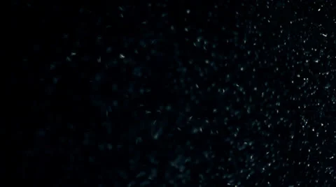 Rain drops on window glass, light spot behind at night, panoramic movement Видео 23724809