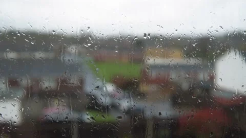 Rain Drops On Window Glass In Monsoon Season. Water Drips Flow Down Blurry Stock Footage 177667148
