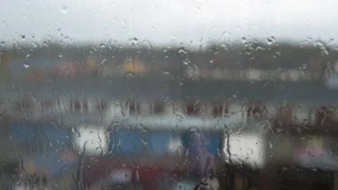 Rain Drops On Window Glass In Monsoon Season. Water Drips Flow Down Blurry Stock Footage 177669416