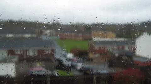 Rain Drops On Window Glass In Monsoon Season. Water Drips Flow Down Blurry Stock Footage 179142376