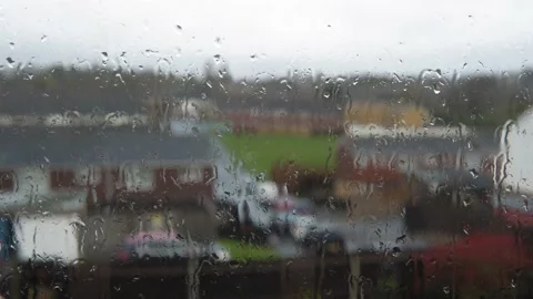 Rain Drops On Window Glass In Monsoon Season. Water Drips Flow Down Blurry Stock Footage 181176495