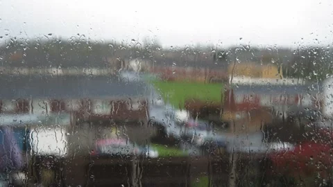 Rain Drops On Window Glass In Monsoon Season. Water Drips Flow Down Blurry Stock Footage 184628740