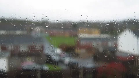 Rain Drops On Window Glass In Monsoon Season. Water Drips Flow Down Blurry Stock Footage 197442046
