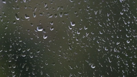 Rain drops on window glass on rainy day Stock Footage 125738008