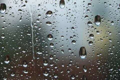 Rain drops on window glass , rainy day Stock Photos
