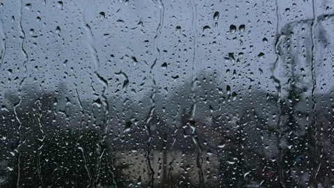 Rain drops on window glass in storm looking, wind blowing the tree strong Stock Footage 104501805