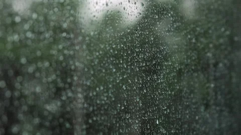 Rain drops on window glass surface. Abstract water droplets on transparent glass Stock Footage 253409735