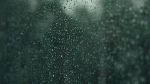 Rain drops on window glass surface. Abstract water droplets on transparent glass Stock Footage 253566577