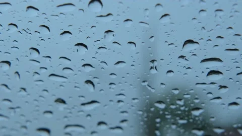 Rain drops on window glass. Water on the car window. 4K Background. Stock Footage 202633643