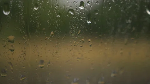 Rain drops on window glasses surface with cloudy background. Natural pattern of Video stock 113698643