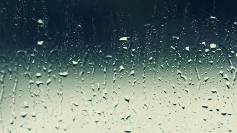 Rain drops on window glasses surface. Cold Fall  autumn Abstract Backdrop Stock Footage 251678931