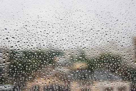 Rain drops on window glasses surface. Natural Pattern of raindrops Stock Photos
